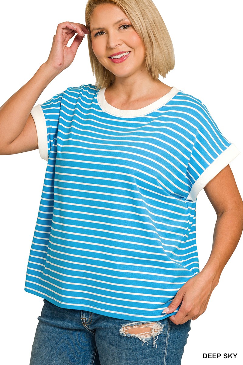 Woman wearing a blue and white striped shirt 