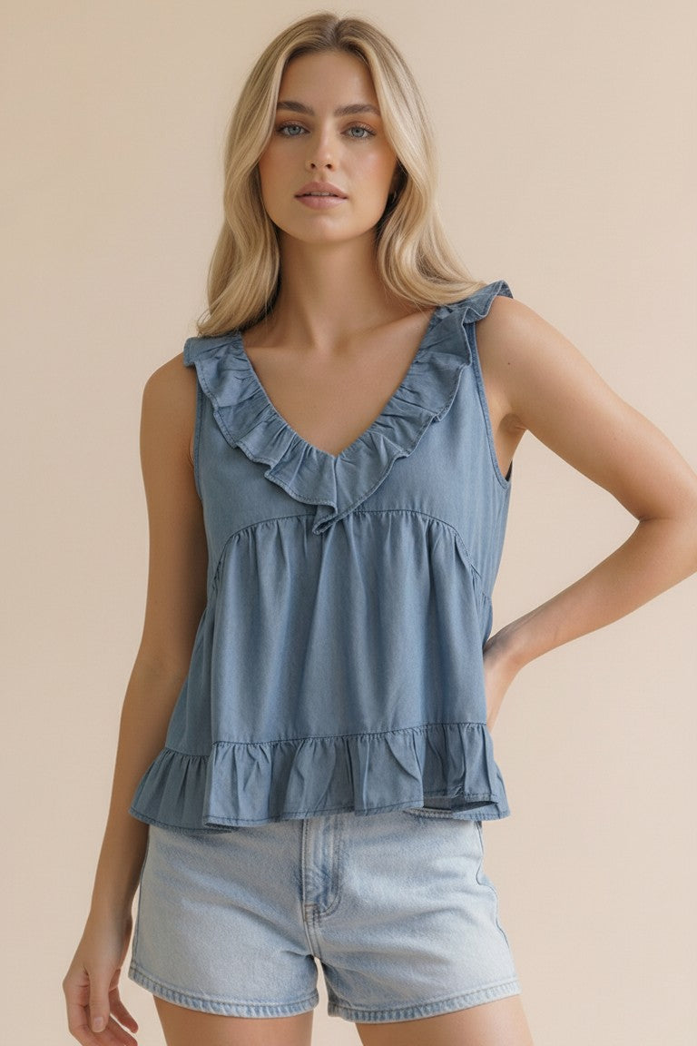 Woman wearing a blue ruffled top 