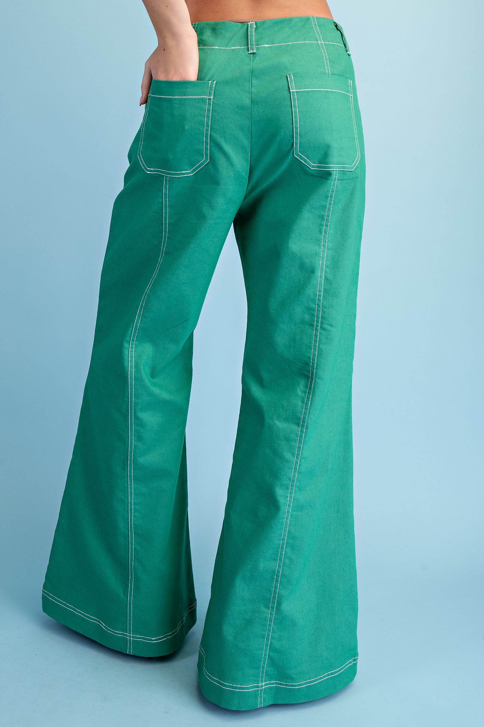 Back view of green pants with pockets