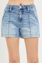 Light blue denim shorts]