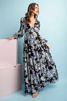 Model wearing long sleeve floral  maxi dress
