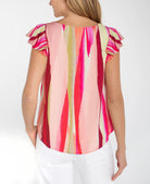 Woman wearing a colorful striped shirt 