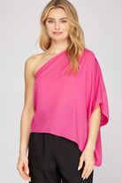 Woman wearing a bright pink one-shoulder top