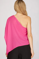 Back of woman wearing a pink one-shoulder top
