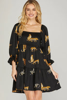 Woman wearing a black dress with jaguar prints 