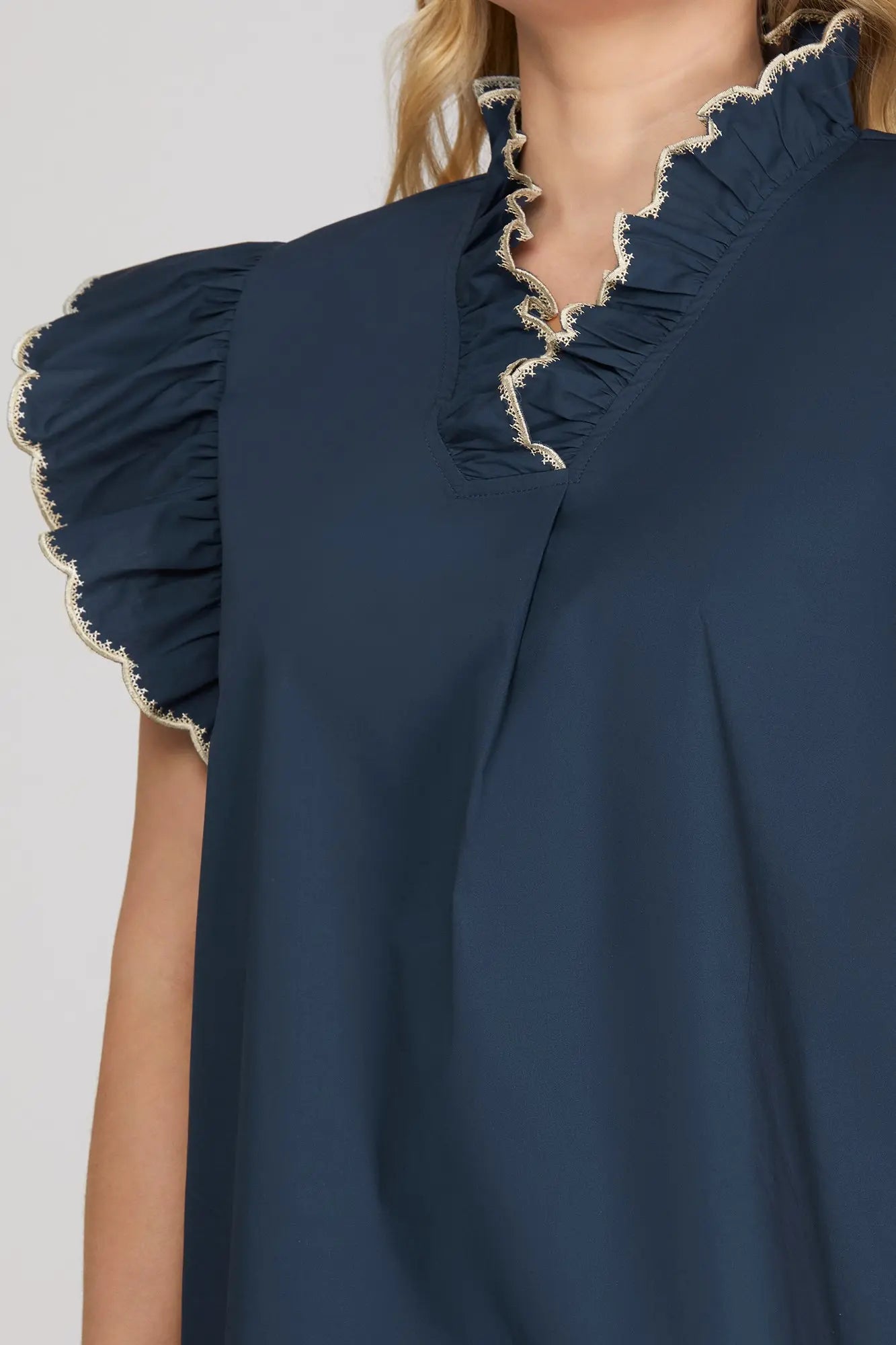 Navy blue top with ruffled sleeves