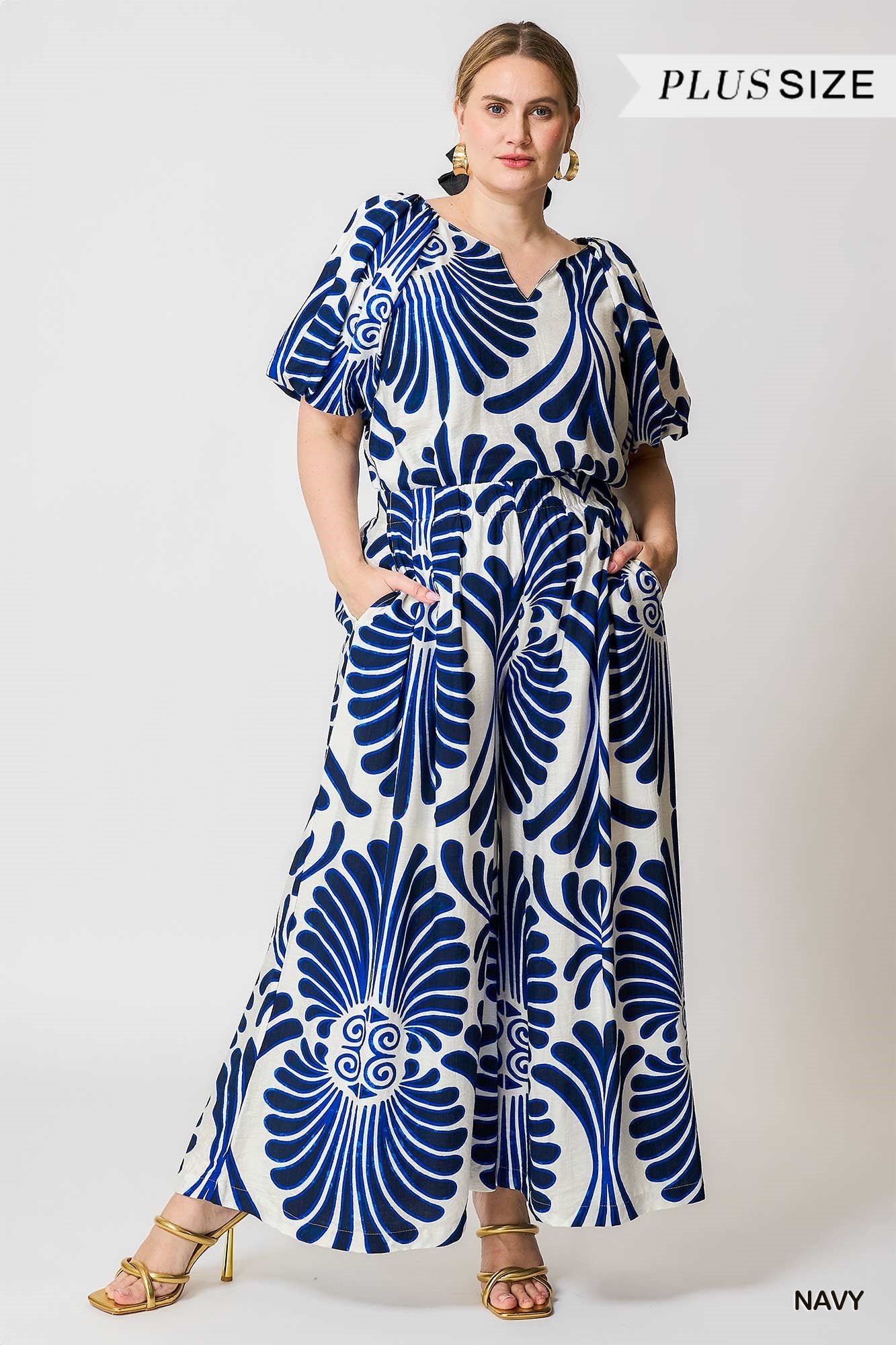 Woman wearing a blue and white patterned palazzo pants 