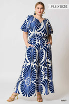 Woman wearing a blue and white patterned palazzo pants 