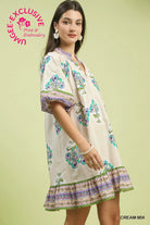 Woman wearing a flower v-neck printed dress
