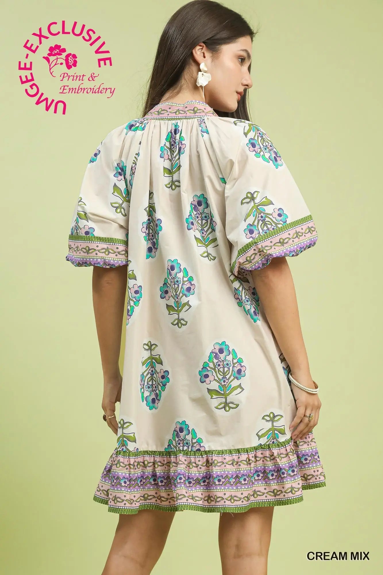 Back of woman wearing a flower v-neck printed dress