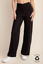 Person wearing black wide-leg pants 