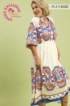 Woman wearing a plus-size dress with colorful floral patterns