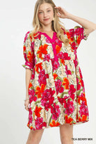 Woman wearing a floral tiered babydoll dress 