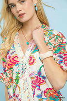 Woman wearing a colorful floral blouse