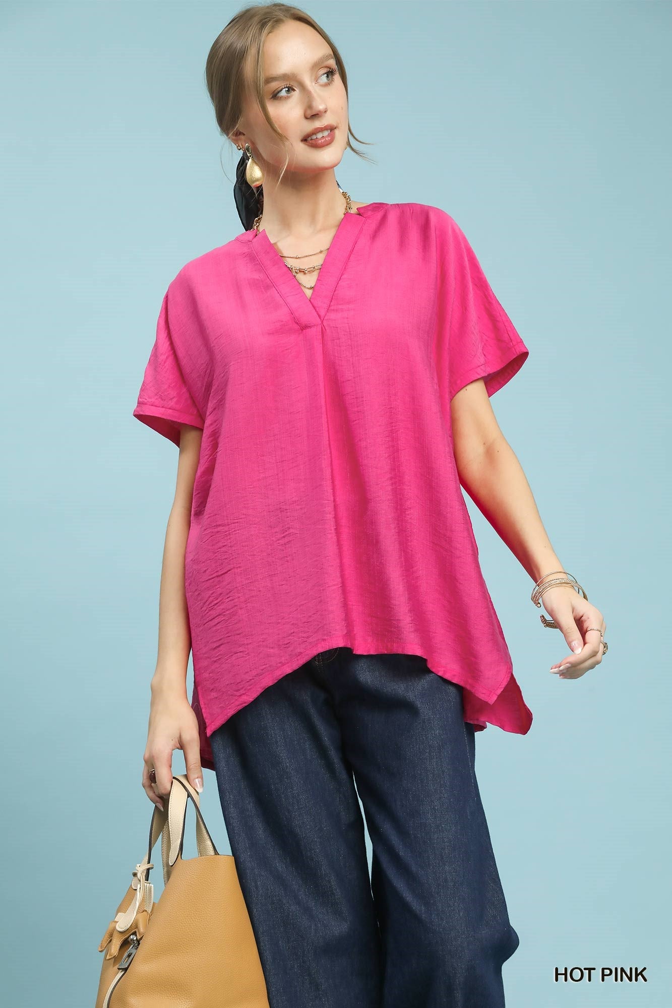Woman wearing a bright pink top 