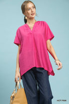 Woman wearing a bright pink top 