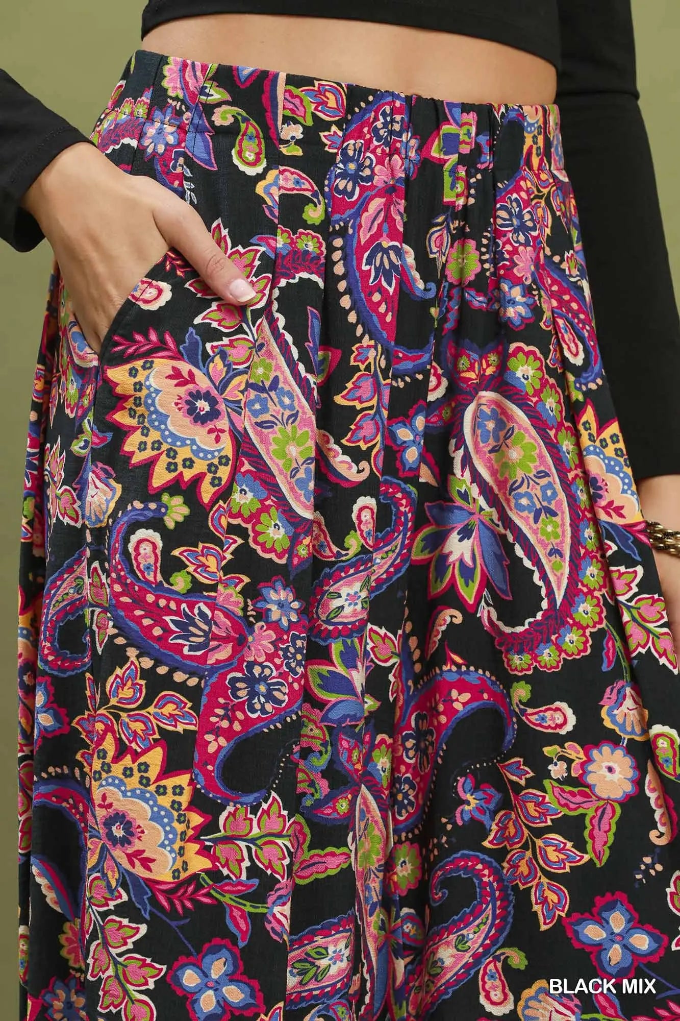 Colorful paisley patterned pants with a black background