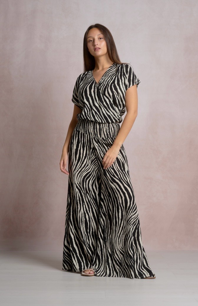 Woman wearing a zebra print outfit 