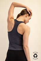 Woman wearing a dark gray tank top 