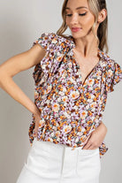 Woman wearing a floral short sleeve top