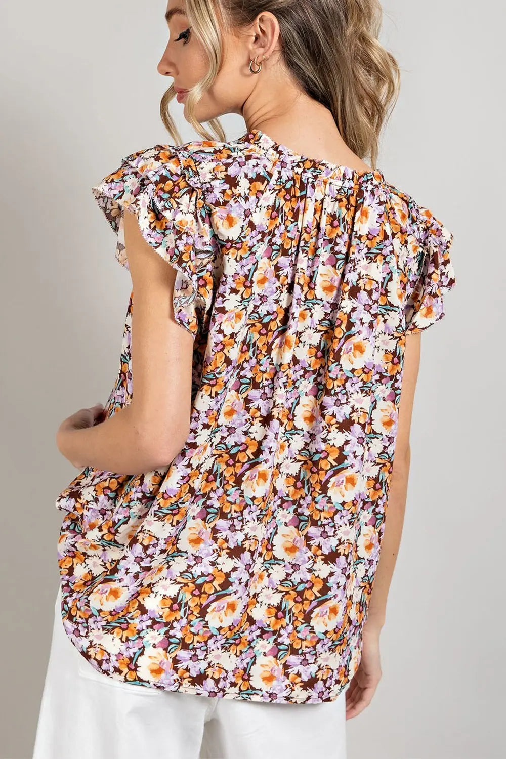 Woman wearing a floral short sleeve top