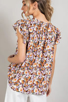 Woman wearing a floral short sleeve top