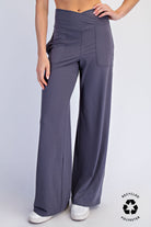Person wearing gray wide-leg pants 