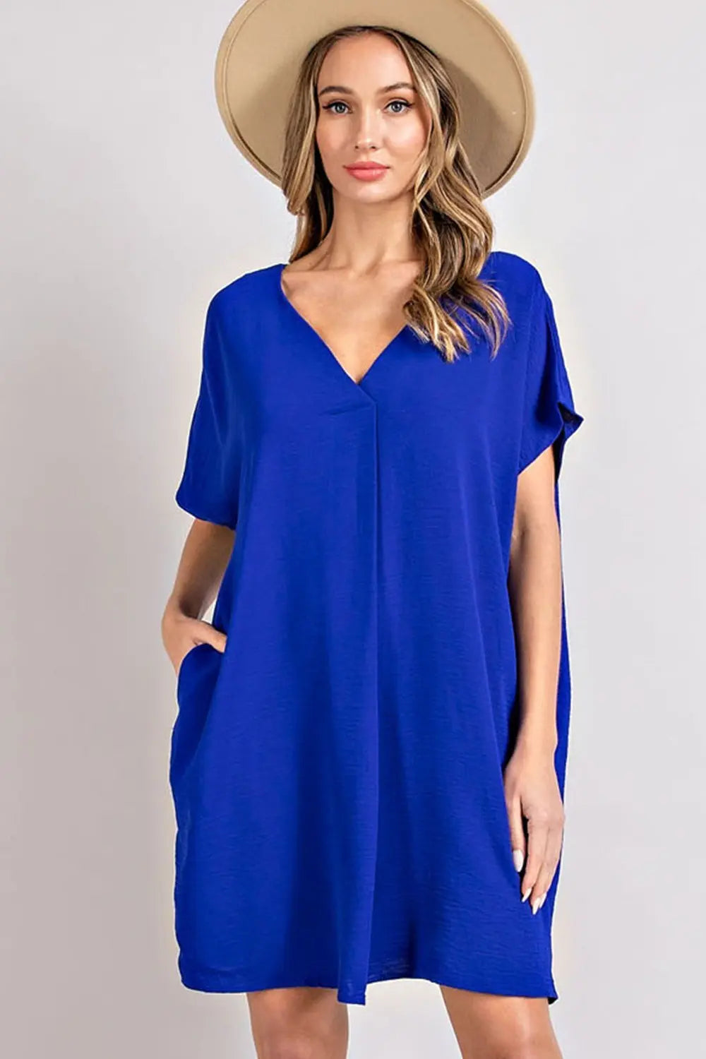 Woman wearing a blue short sleeve mini dress 