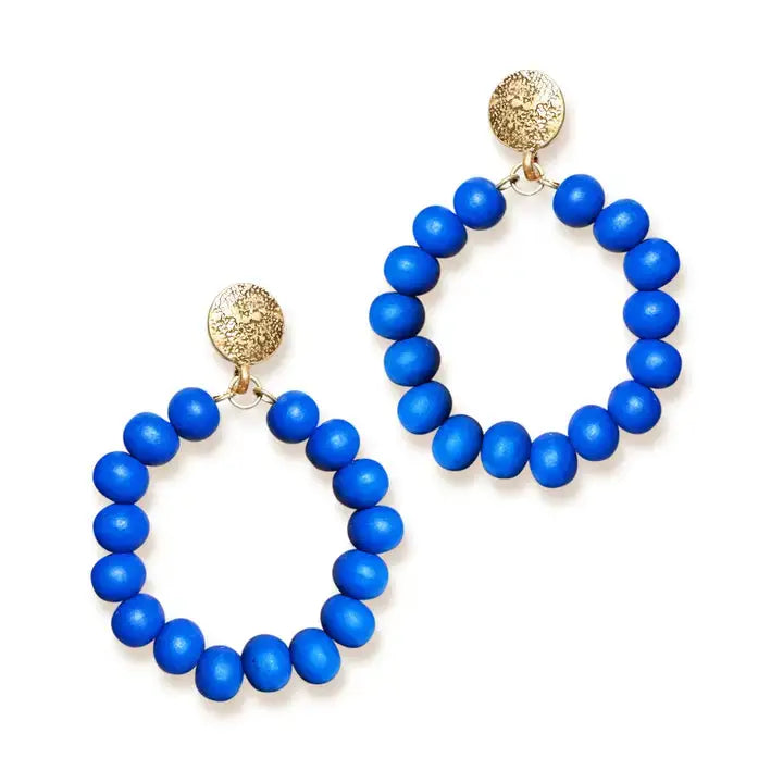 Royal blue earrings on white background 