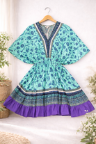 Colorful dress with floral pattern and purple bottom 