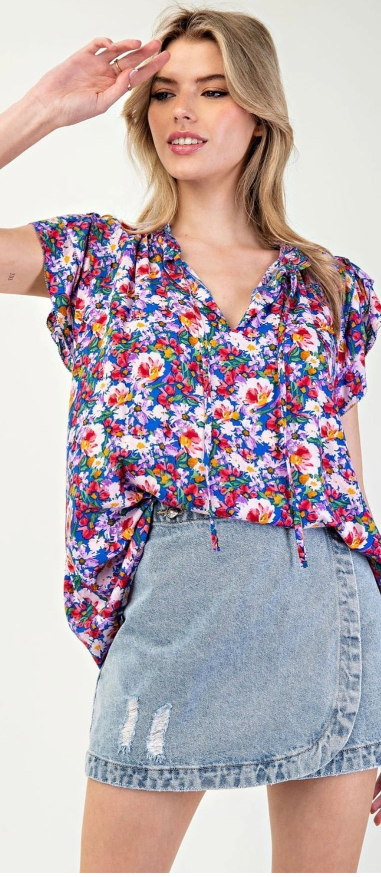 Model wearing Royal blue floral tank With Jean skort