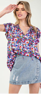 Model wearing Royal blue floral tank With Jean skort