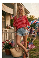 Model wearing red and white striped shirt and jean shorts