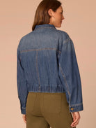 Back view of lady wearing jean jacket 
