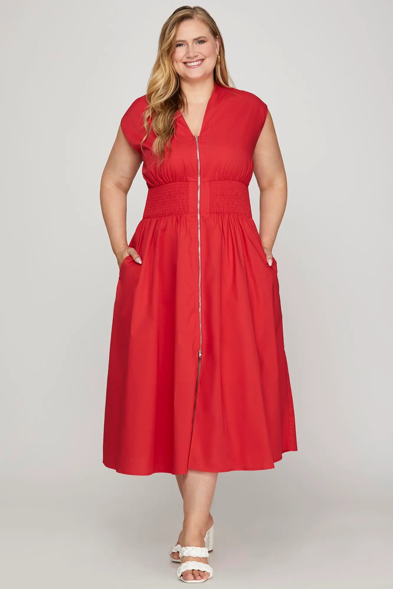 Woman wearing a red dress with a zipper 