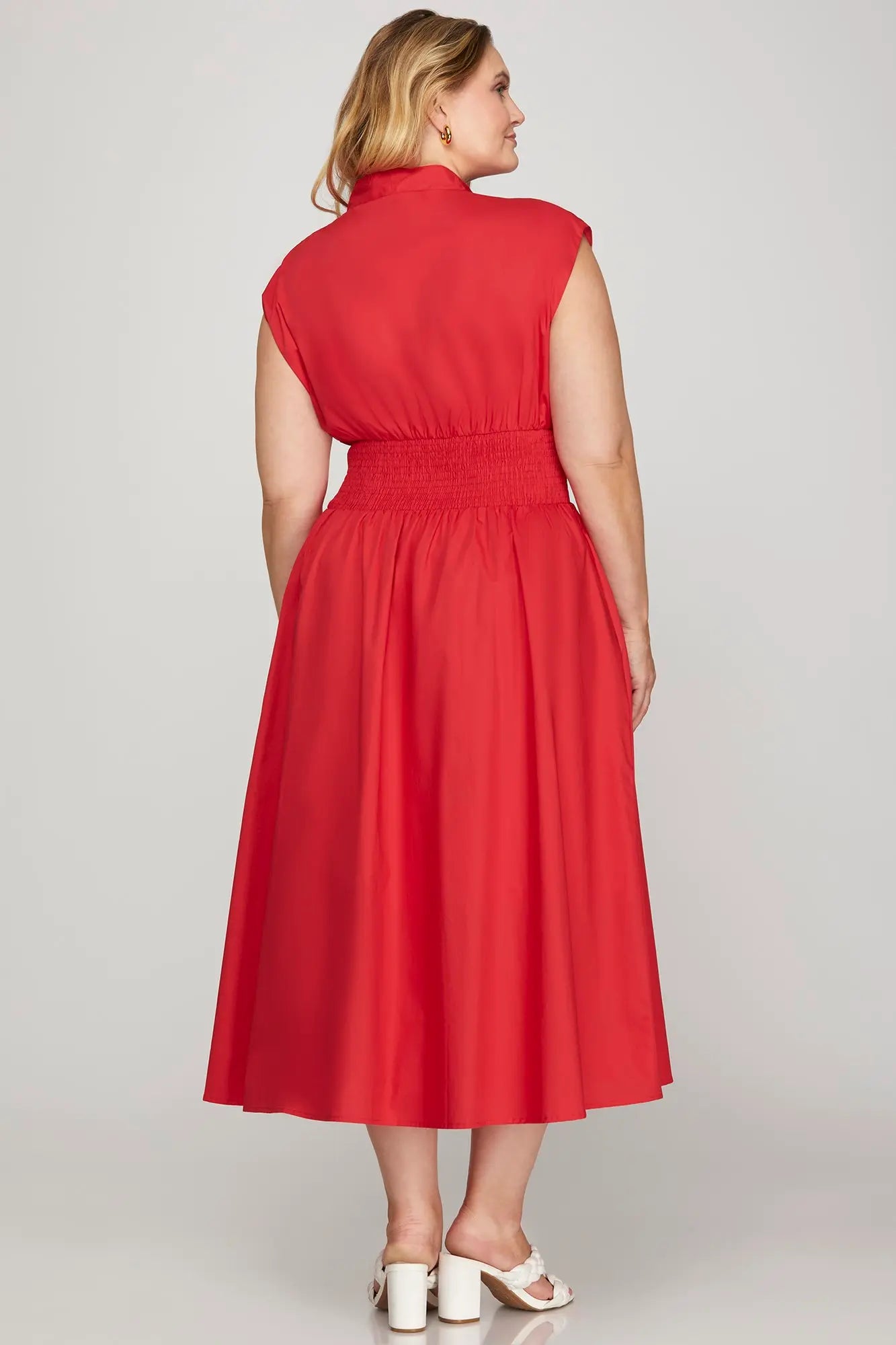 Woman wearing a red dress back view