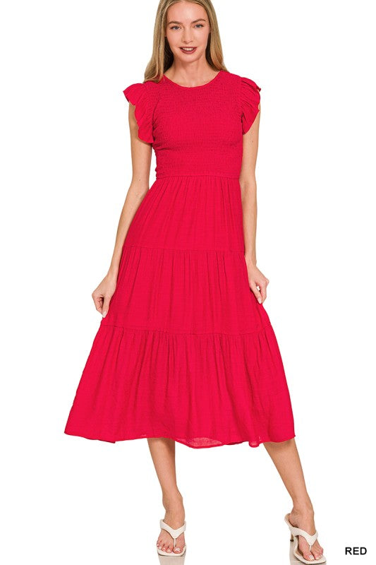 Red dress with ruffled sleeves worn by a model 