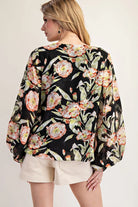 Value of model wearing black floral top  and shorts 