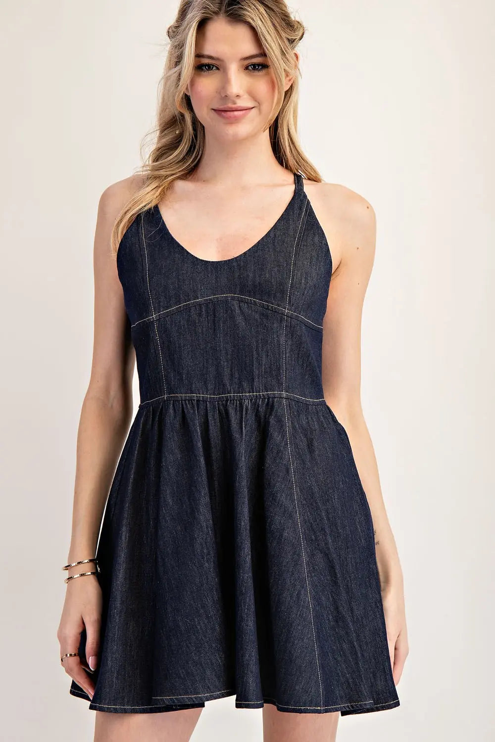 Model wearing spaghetti strap dark denim dress