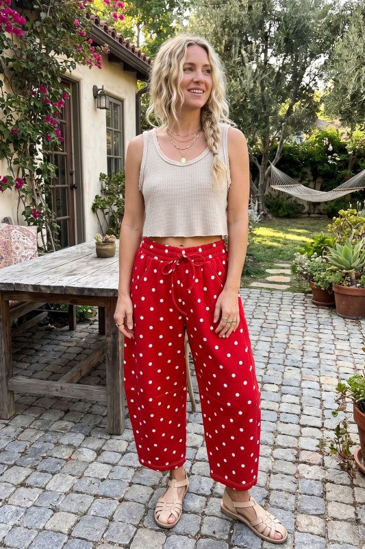 Model wearing red polkadot pants