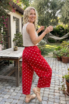 Side view of model wearing red polkadot pants