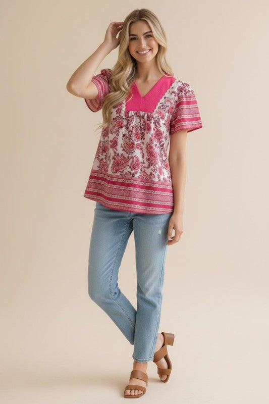 Model wearing bohemian top and jeans 
