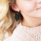 Model wearing Black show stopper earrings 