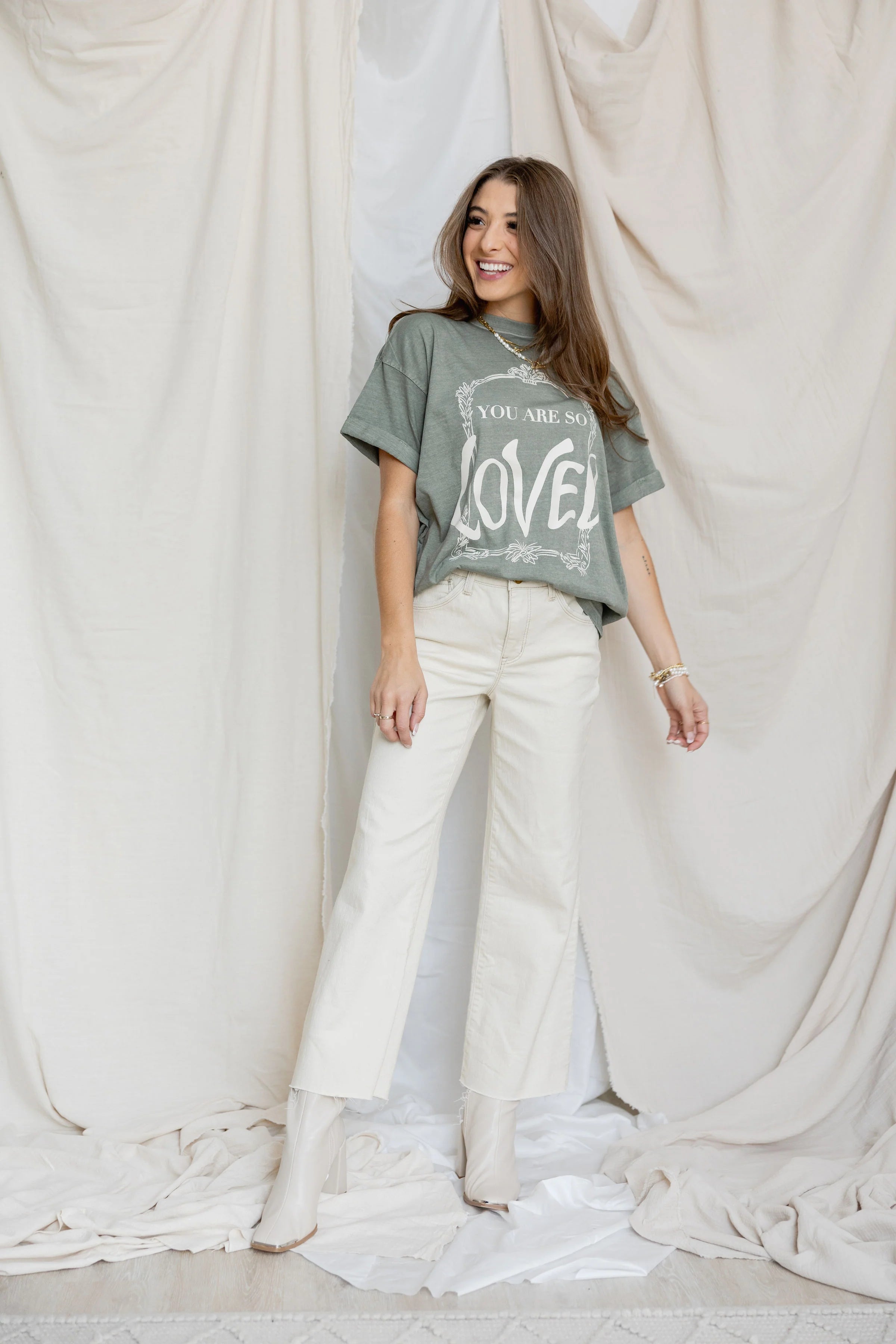 Front view of You are so loved tee and white jeans 