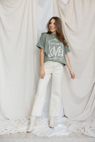 Front view of You are so loved tee and white jeans 