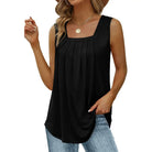 Black sleeveless top worn by a model on a white background