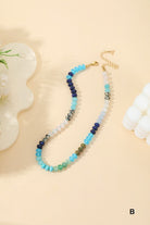 Multicolored beaded necklace on a beige background