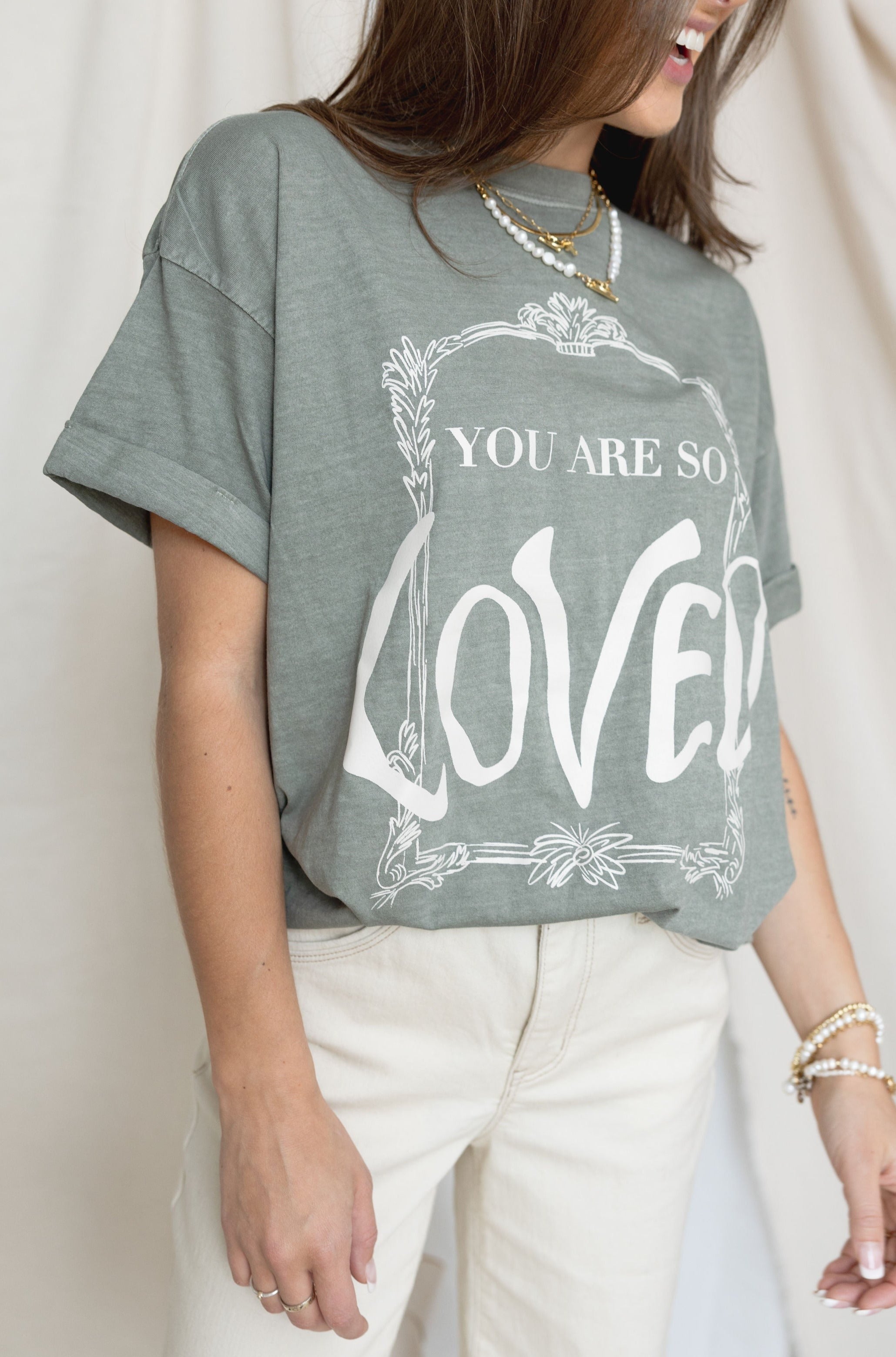 YOu are so loved shirt and white jeans