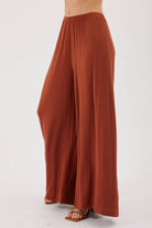 MODEL WEARING NUTMEG PANTS