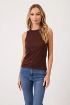 MODEL WEARING CHOCOLATE TANK AND JEANS